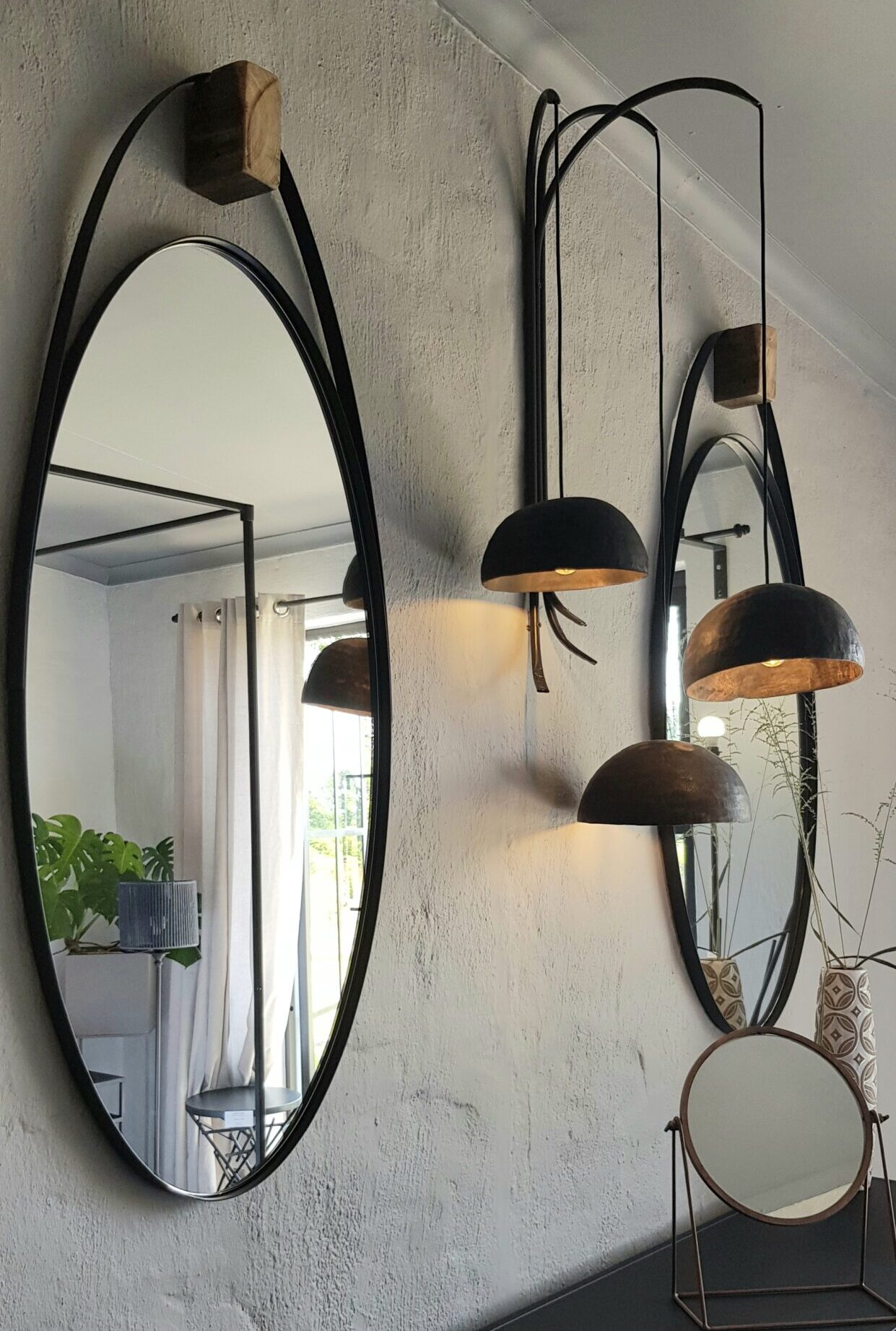 oval mirror with lights around it